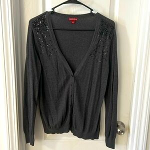 Gray cardigan with glittered shoulders.